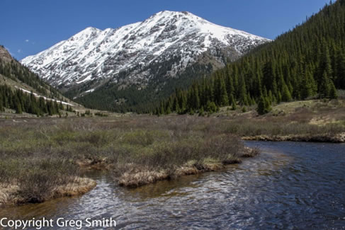 Colorado snow-capped mountain and stream